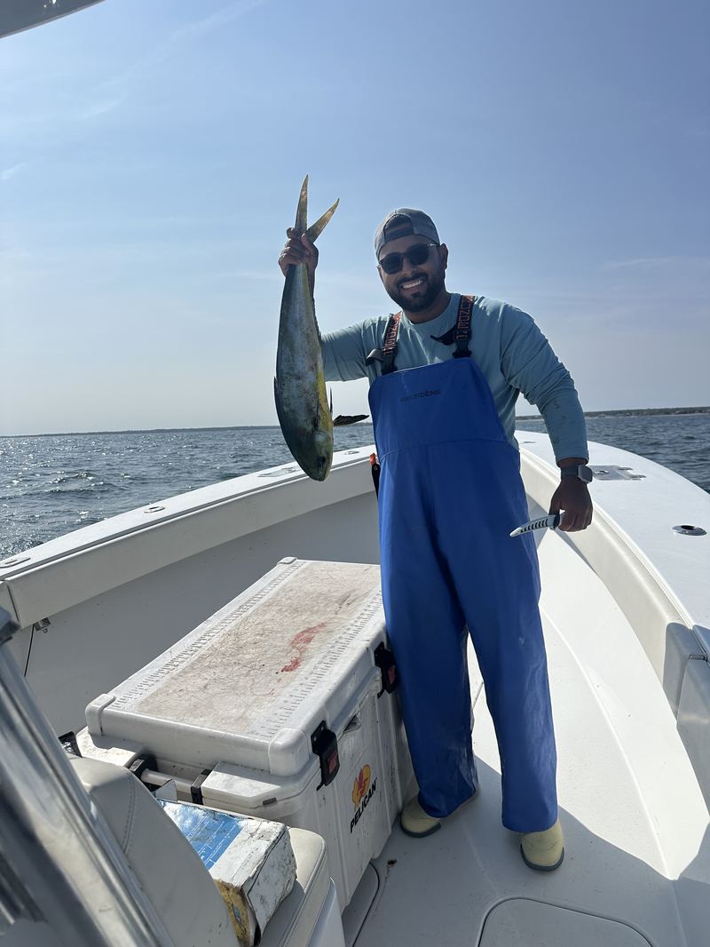 Angler holding a mahi mahi up caught offshore