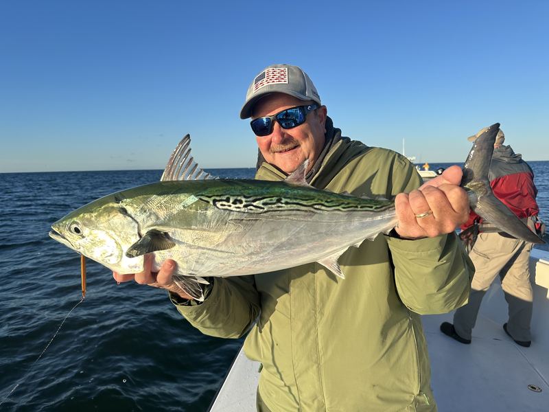 Angler with a big bonito on a Cape Cod fall charter