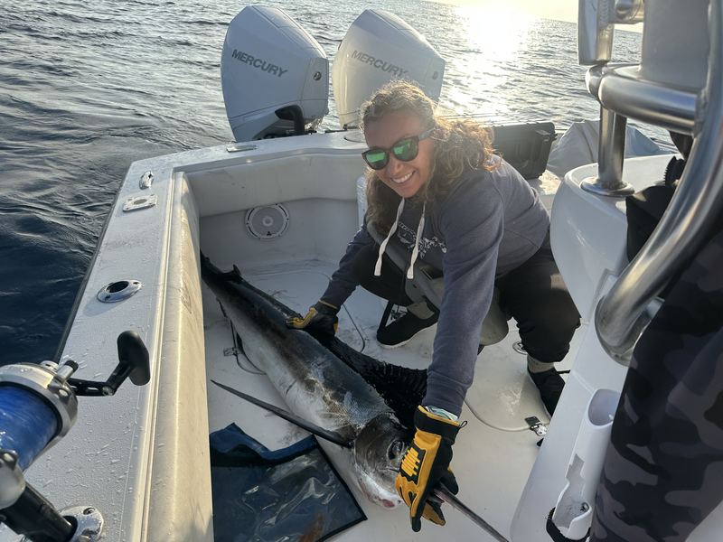 Angler with a false albacore on a fall charter
