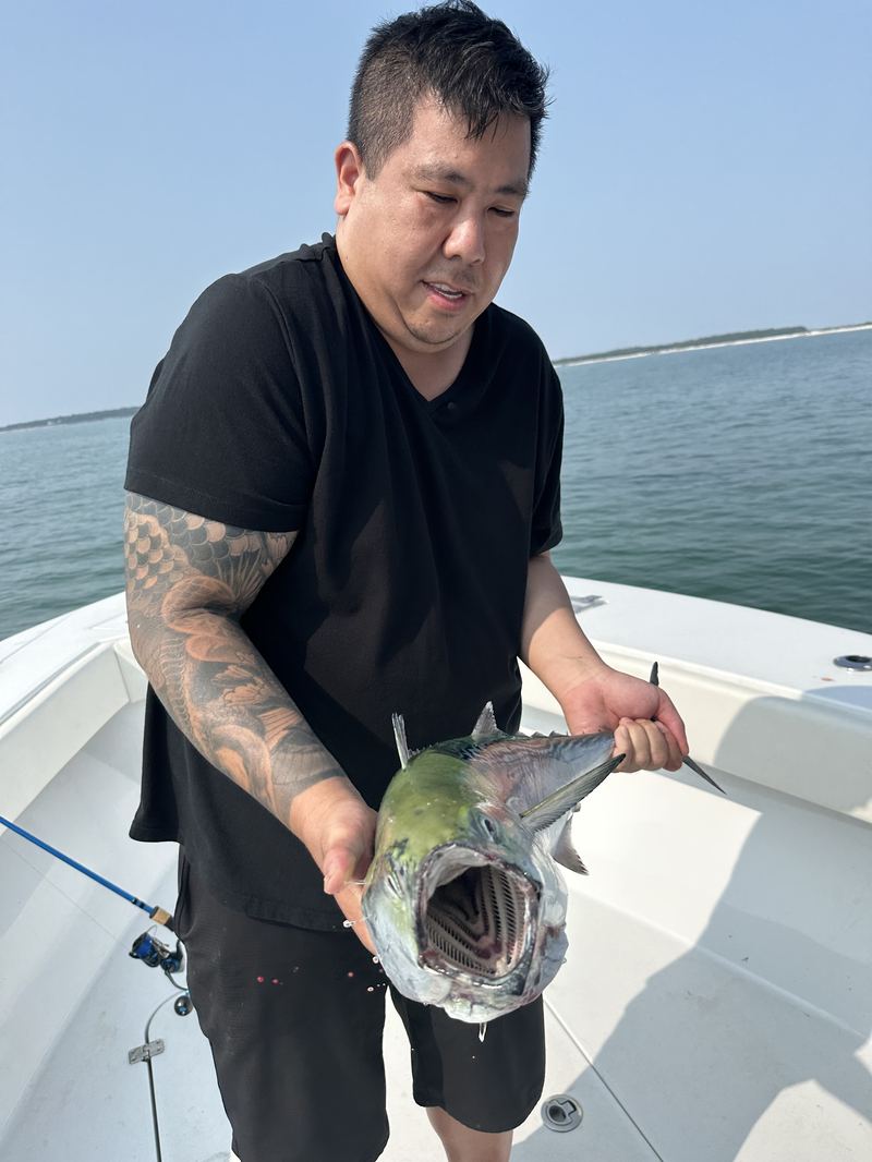 Angler with a mahi mahi caught offshore of Cape Cod