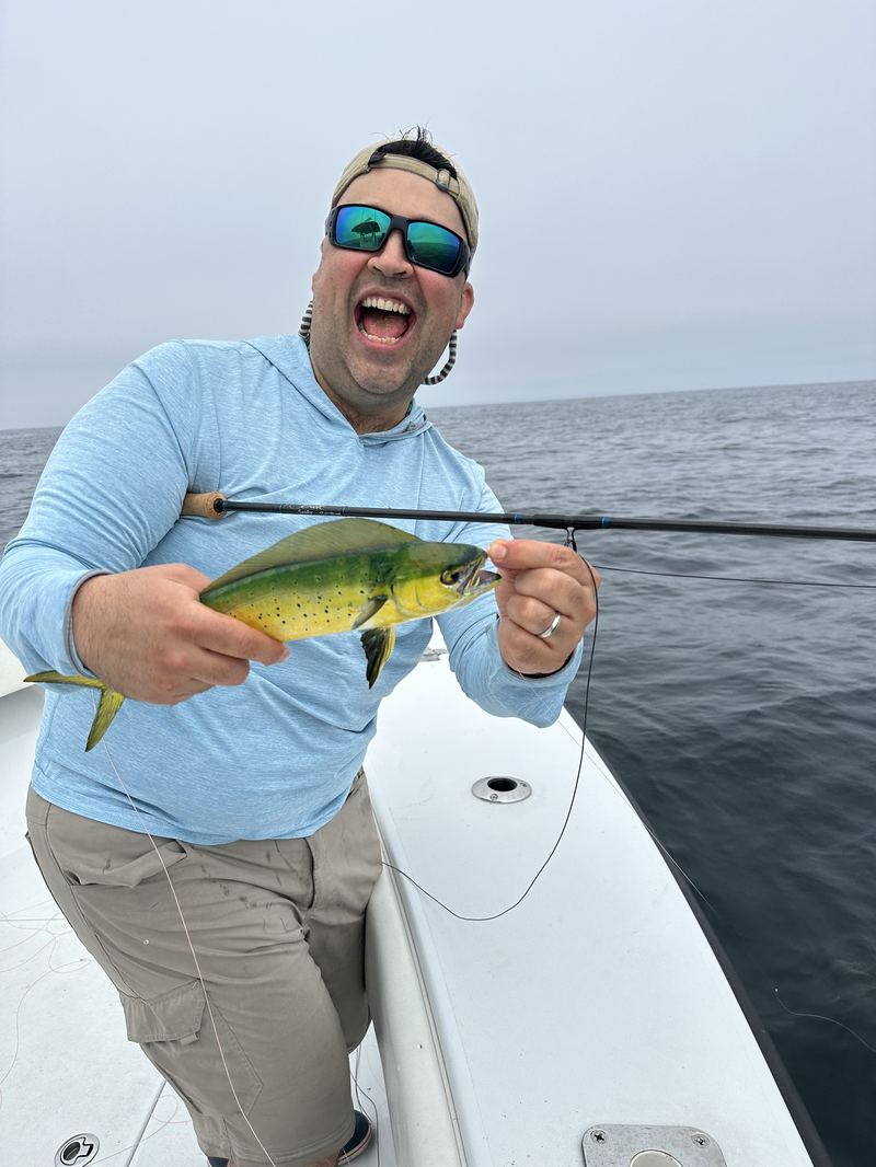 Angler with a mahi mahi on an offshore Cape Cod charter