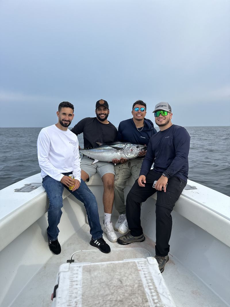 Group of four anglers with their catch on a charter