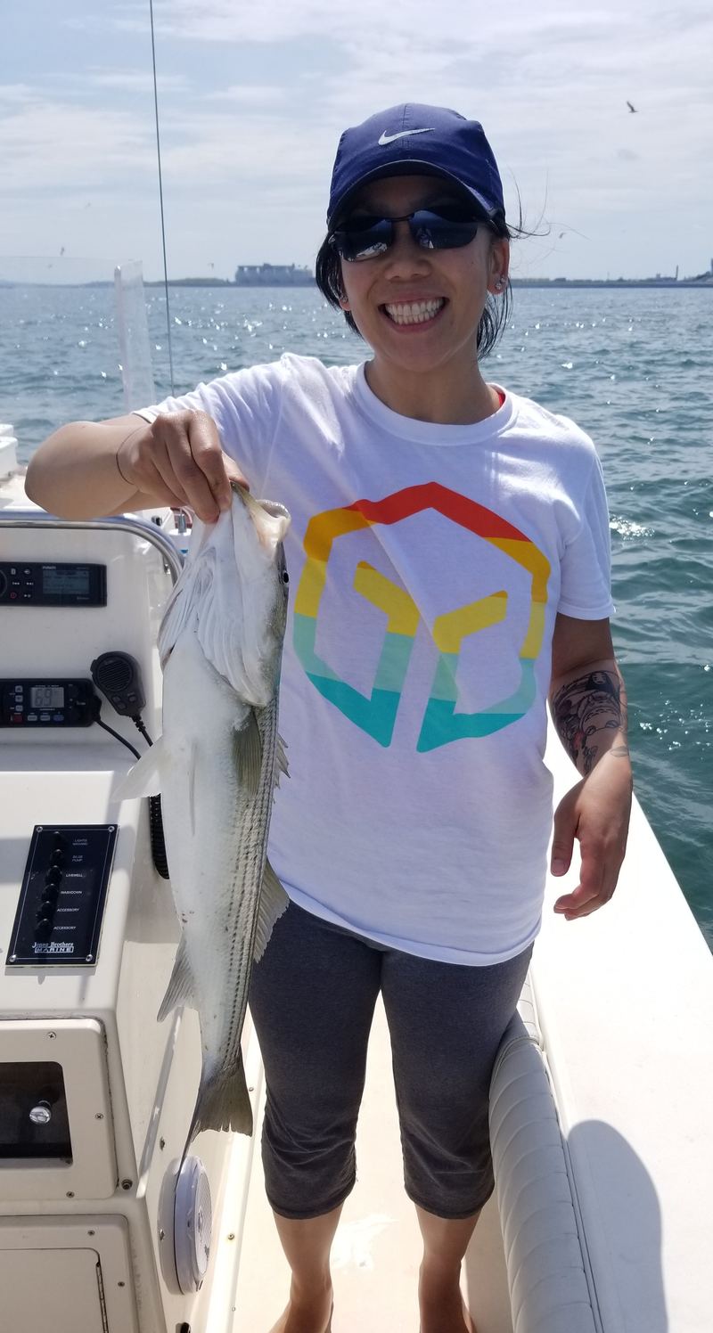 Melissa with a light tackle striper in Boston Harbor
