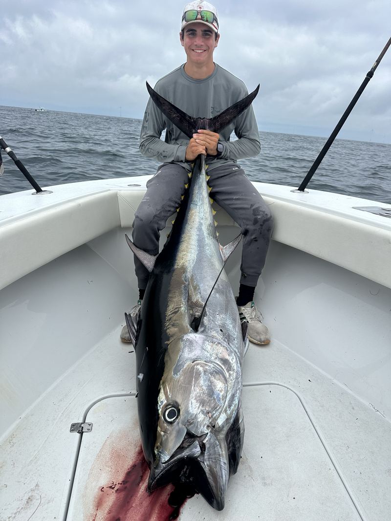Angler with a bluefin tuna caught offshore of Cape Cod